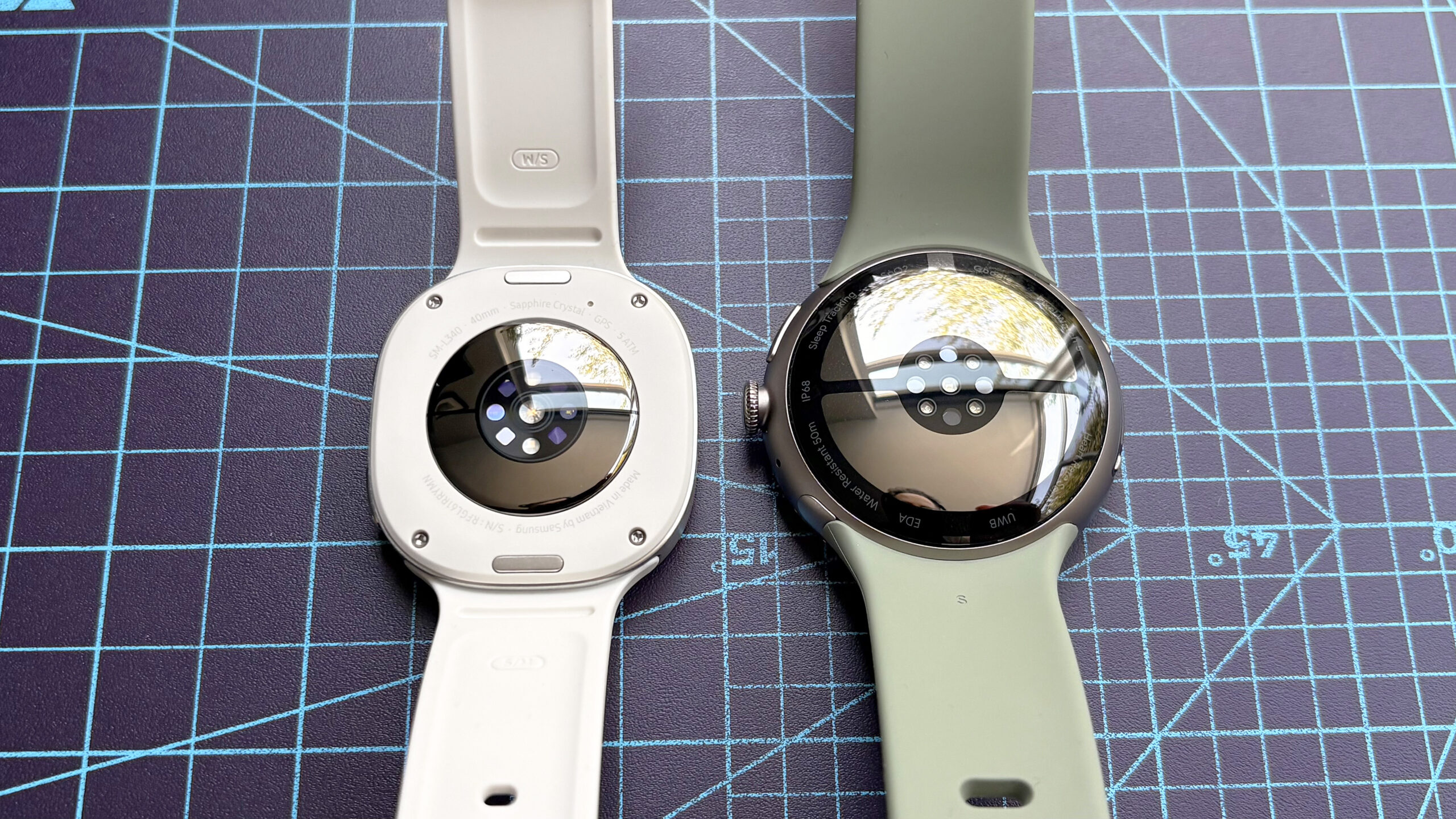 لقطة مقربة لساعة Samsung Galaxy Watch 9 بجانب Google Pixel Watch 5